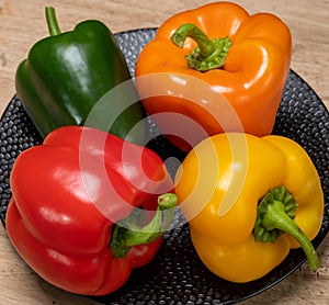 Fresh red, orange, green and yellow sweet bell paprika