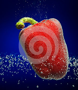 Fresh red paprika with bubbles