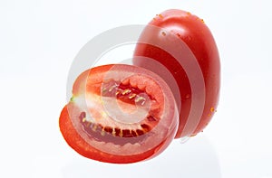 Fresh red pear tomatoes, mini tomatoes, on white background