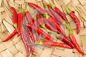 Fresh red peppers on wooden background