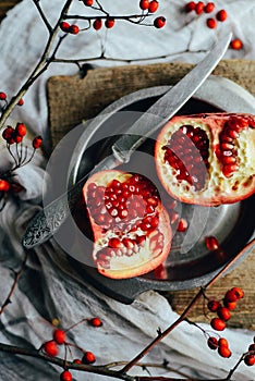 Fresh red pomegranate and grapefruit On a wooden background. Pom