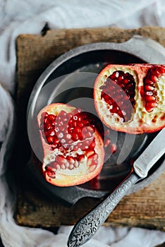 Fresh red pomegranate and grapefruit On a wooden background. Pom