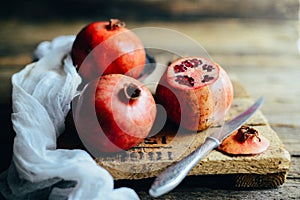 Fresh red pomegranate and grapefruit On a wooden background. Pom