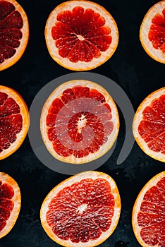 Fresh red pomegranate and grapefruit On a wooden background. Pom