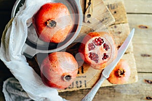 Fresh red pomegranate and grapefruit On a wooden background. Pom