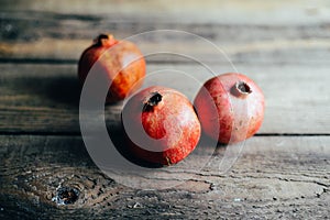 Fresh red pomegranate and grapefruit On a wooden background. Pom