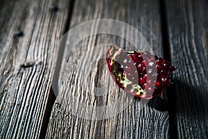 Fresh red pomegranate and grapefruit On a wooden background. Pomegranate