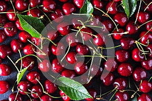 Fresh red ripe cherries on dark grey table