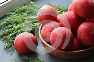 Fresh red ripe tomatoes and fresh herbs for salad