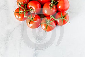 Fresh Red Ripe Tomatoes On The Vine On Marble Background