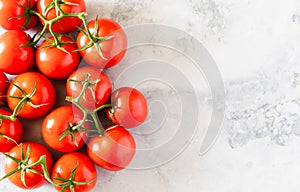 Fresh Red Ripe Tomatoes On The Vine On Marble Background