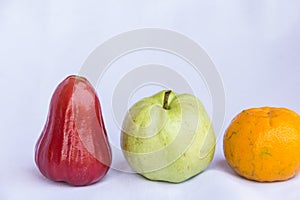 Fresh red rose apple,orange and green guava clean fruit