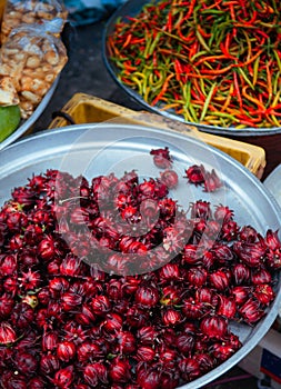 Fresh red Roselle fruit sell at local vegetable shop at Kim Yong market, Hat Yai - Songkhla - Thailand