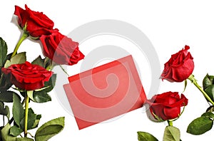 Fresh red roses and blank paper for notes on white background.