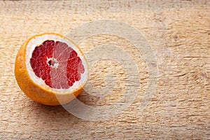 Fresh red sliced pomegranate and grapefruit On a wooden background