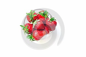 Fresh red strawberries in transparent bowl isolated on white background
