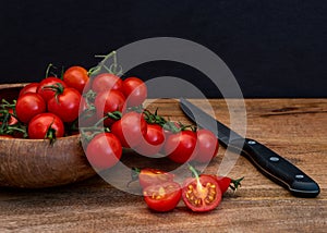 Fresh red tomatillos on black