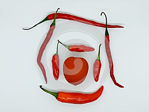 Fresh red tomato and chili isoated on white background