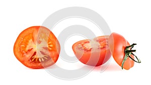 Fresh red tomato cut into pieces, isolated