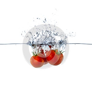 Fresh Red Tomato Fruits Sinking in Water