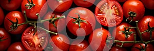 Fresh red tomatoes background, banner, texture. Cherry tomatoes branch wholes and halves closeup top view