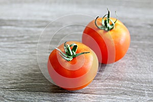 Fresh red tomatoes on a board