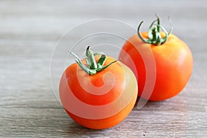 Fresh red tomatoes on a board