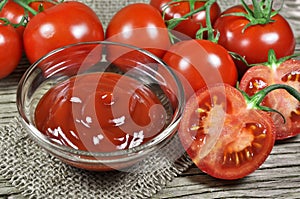 Fresh red tomatoes and ketchup