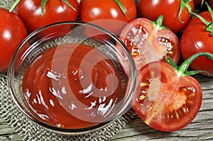 Fresh red tomatoes and ketchup