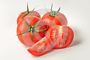 Fresh red tomatoes on white background