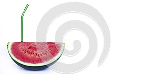 Fresh red watermelon and glass green eco reusable straw isolated on white background. fresh fruits and natural juices. Space for