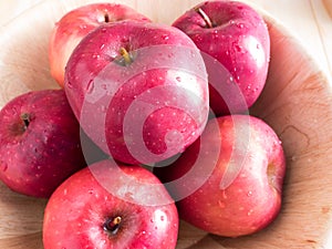 Fresh red wet apples with water drops