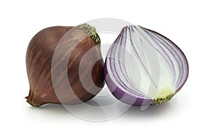 Fresh red whole and sliced onions isolated on white background.