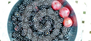 Fresh redberries and ripe plums