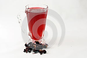 Fresh refrigerated Roselle juice glass with dried Roselle herbs isolated on white background