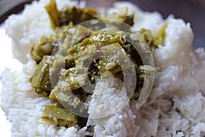 Fresh Ridge gourd curry and rice isolated on white background