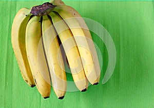 Fresh bananas on wooden background