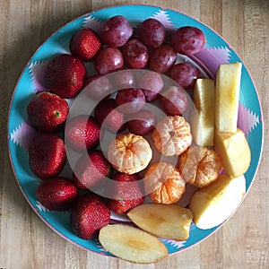 Fresh and Ripe Berry fruit Bowl on Wooden Table