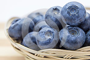 Fresh ripe blueberries in wicker basket
