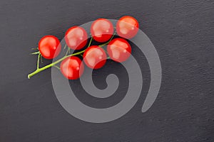Fresh ripe branch tomato red cherry tasty harvest black background copy space