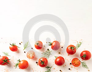Fresh ripe cherry tomatoes with dill, salt and pepper on a white wooden background with space for text. Vertical position, top