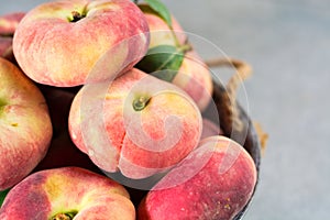 Fresh ripe chinese flat saturn peaches with leaves
