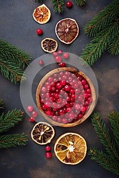 Fresh ripe cranberry in wooden bowl