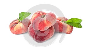 Fresh ripe donut peaches with leaves on white background