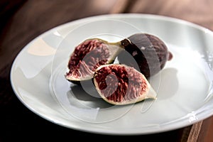 Fresh ripe fig on blue dish