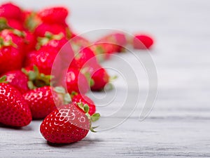 Sweet fresh strawberries on a gray wooden table. Food concept. photo