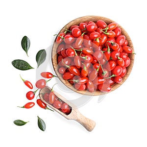 Fresh ripe goji berries, bowl and scoop on white background, top view