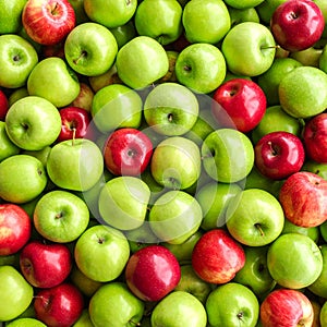 Fresh ripe green and red apples as background, top view