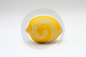 Fresh, ripe, isolated, juicy single lemon on a white background. Studio macro shoot