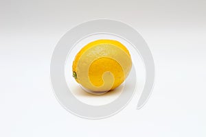 Fresh, ripe, isolated, juicy single lemon on a white background. Studio macro shoot